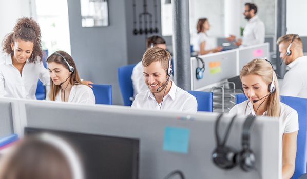 Call center agents working in an outsourced service center