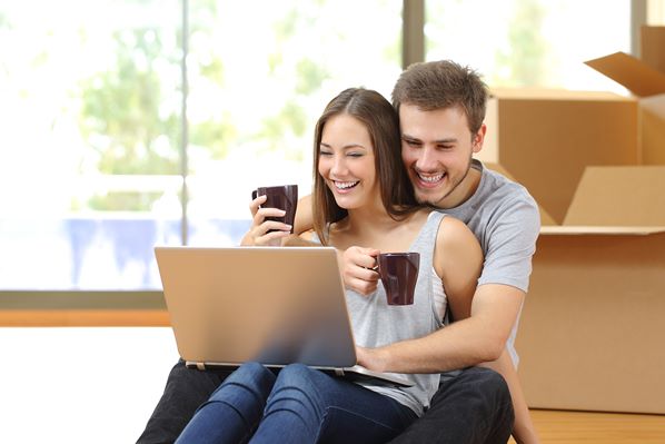 Young couple buying furniture online