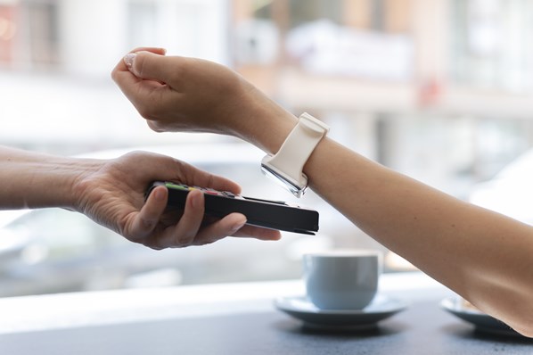 Customer paying using smart watch