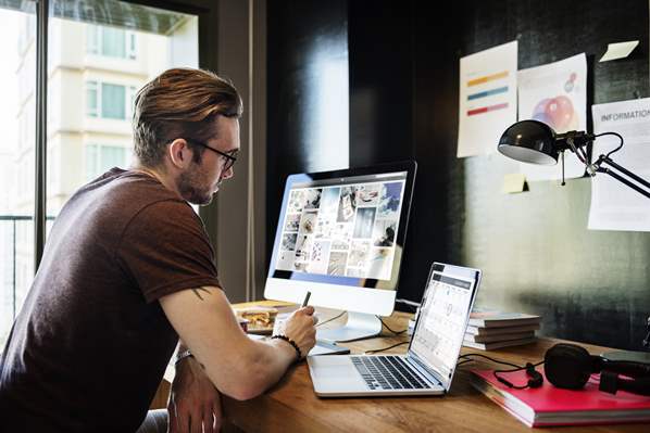 Web designer working on his computer