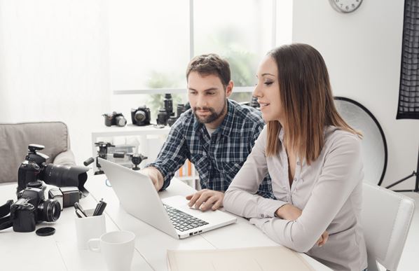 People editing photos on computer