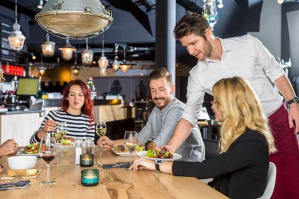 Waiting in a restaurant serving customers