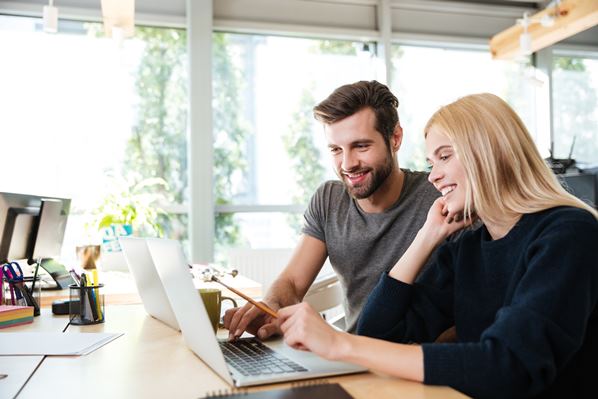 Business colleagues working at computer