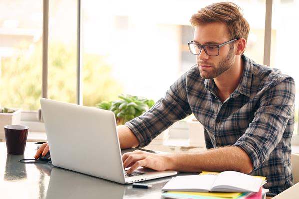 Man playing online on his laptop