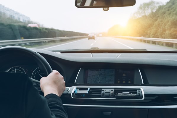 Driver holding steering wheel