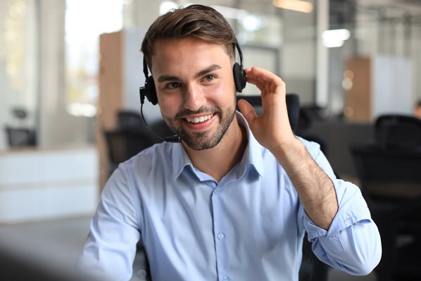 Manager wearing telephone headset