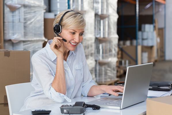 Online retailer talking to customer using a headset