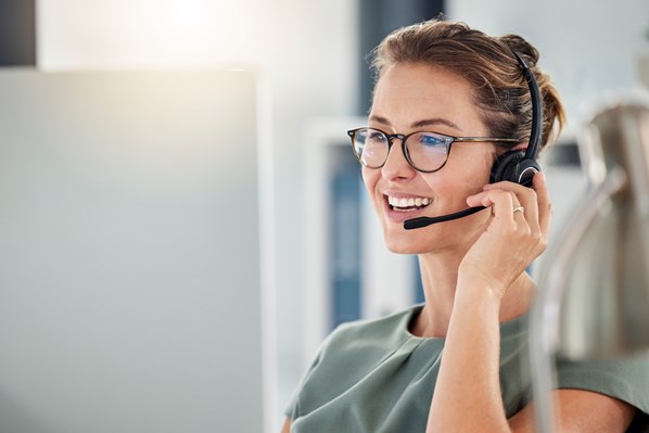 Manager talking to customer using a headset