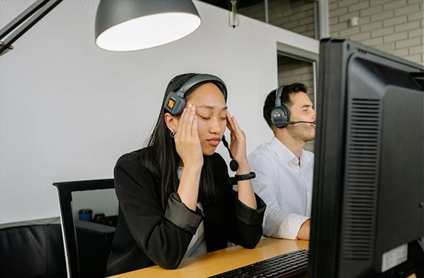 Customer service representative with headache