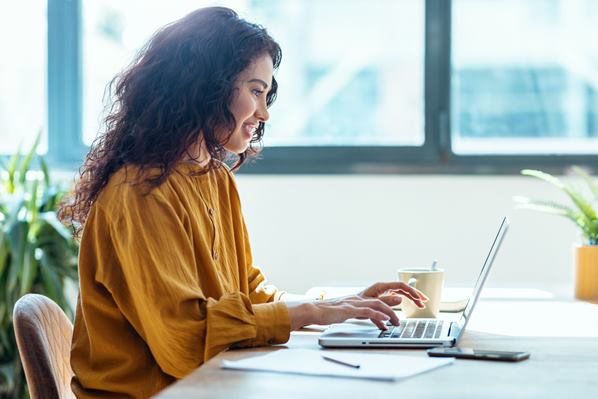 Women doing online training on her laptop