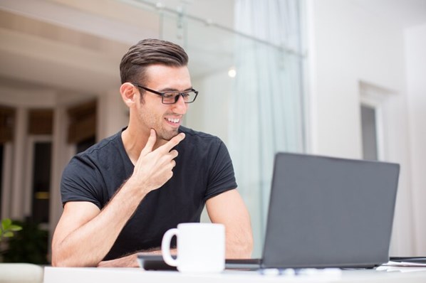 Man playing games on laptop