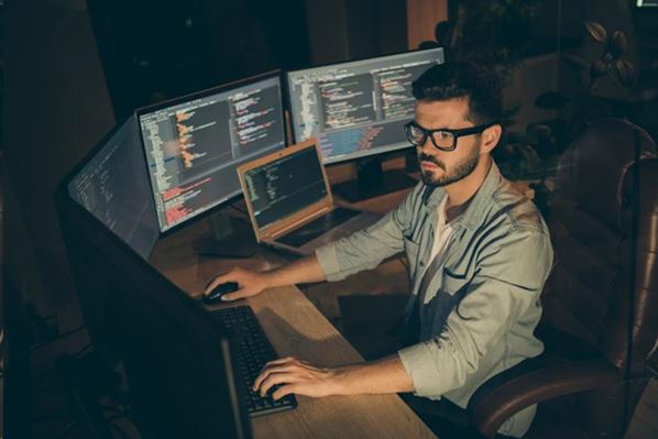 Cybersecurity manager working on his computer