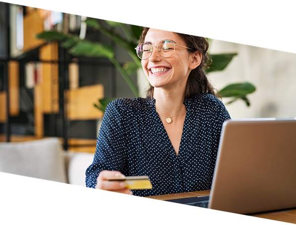 Customer paying by credit card on her laptop