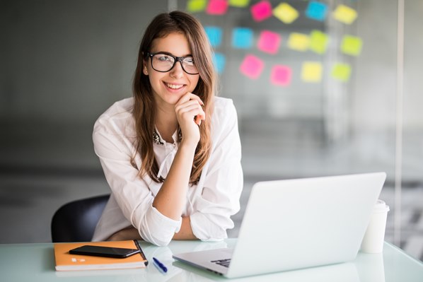 Young manager studying on her laptop