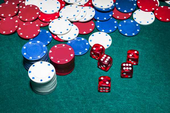 Cards and dice on green table