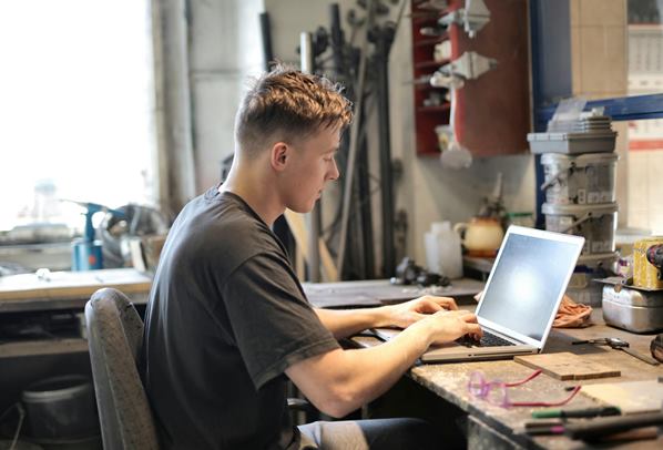 Field service engineer working on his laptop