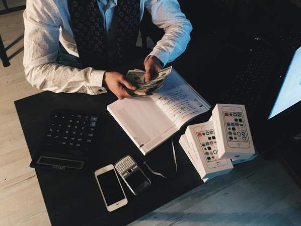 Business person counting his money