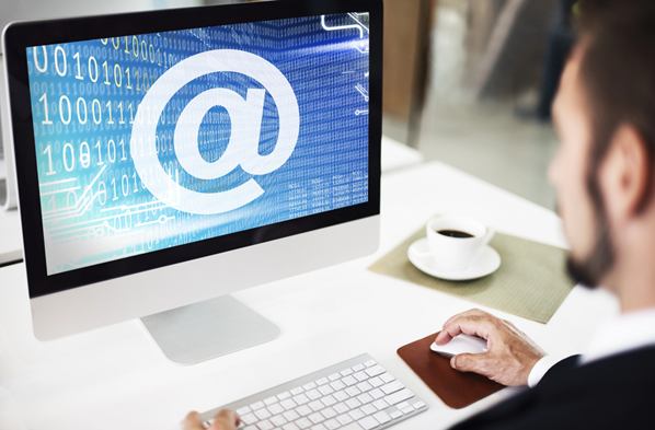 A man reading his emails