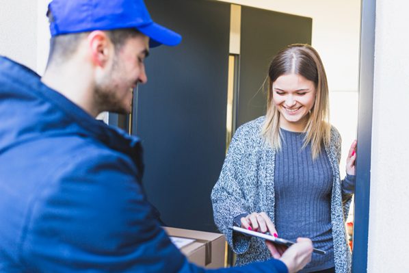 A business customer signing for a delivery