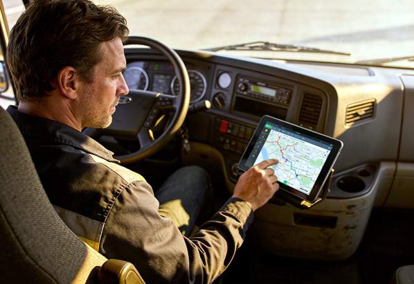A truck driver using a route planner