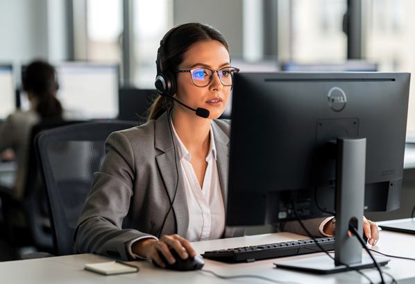 Contact center agent looking at her screen
